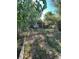 Backyard with chain link fence, small shed, and gravel at 2080 Emporia St, Aurora, CO 80010