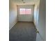 Bright bedroom with window and carpeted floor at 8031 Wolff St # H, Westminster, CO 80031