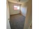 Bright bedroom with a window and carpeted floor at 8031 Wolff St # H, Westminster, CO 80031