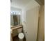 Simple bathroom with toilet and sink vanity at 8031 Wolff St # H, Westminster, CO 80031