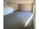 Bright living room with neutral carpeting and stairs at 8031 Wolff St # H, Westminster, CO 80031