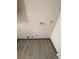 Unfinished laundry area with laminate flooring and plumbing hookups at 8031 Wolff St # H, Westminster, CO 80031