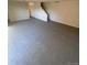 Living room features neutral carpeting and access to stairs at 8031 Wolff St # H, Westminster, CO 80031