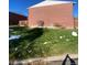 Brick building exterior with small front yard at 8031 Wolff St # H, Westminster, CO 80031
