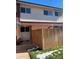 Exterior view of a townhouse with a wooden fence and small deck at 8031 Wolff St # H, Westminster, CO 80031