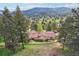 Aerial view of house with mountain views and large lot at 115 Spruce Rd, Golden, CO 80401