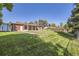 Landscaped backyard with a large grassy area and detached shed at 752 S Union Blvd, Lakewood, CO 80228