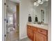 Bathroom with single sink vanity and tub at 4864 Harness Ct, Parker, CO 80134