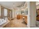 Elegant bathroom with soaking tub, shower, and double vanity at 4864 Harness Ct, Parker, CO 80134