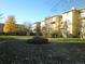 Apartment building with landscaping and trees at 610 S Alton Way # 8D, Denver, CO 80247