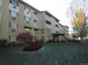 Building exterior showcasing landscaping and lawn at 610 S Alton Way # 8D, Denver, CO 80247