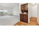 Bright dining area with built-in cabinetry and hardwood floors at 610 S Alton Way # 8D, Denver, CO 80247