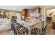 Basement wet bar with granite countertop and seating at 7717 S Grape Ct, Centennial, CO 80122