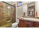 Bathroom with walk-in shower and modern vanity at 6297 Ellingwood Point Way, Castle Rock, CO 80108