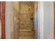 Spa-like shower with multiple shower heads and tiled walls at 6297 Ellingwood Point Way, Castle Rock, CO 80108