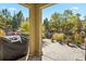Covered patio with a grill and a view of a landscaped backyard at 6297 Ellingwood Point Way, Castle Rock, CO 80108