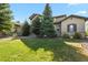Two-story house with landscaping and a large front yard at 6297 Ellingwood Point Way, Castle Rock, CO 80108