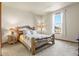 Bedroom with a log bed frame and two lamps on the side tables at 6297 Ellingwood Point Way, Castle Rock, CO 80108