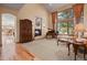 Spacious living room with fireplace, large windows, and hardwood floors at 6297 Ellingwood Point Way, Castle Rock, CO 80108