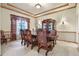 Formal dining room with wood table and chairs, and hardwood floors at 6297 Ellingwood Point Way, Castle Rock, CO 80108