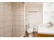 Basement bathroom with tile shower, toilet and vanity at 7900 W Layton Ave # 833, Littleton, CO 80123