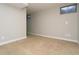 Spacious finished basement bedroom with neutral carpeting and large windows at 7900 W Layton Ave # 833, Littleton, CO 80123