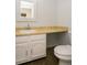 Clean bathroom with white vanity, tile flooring and a framed mirror at 7900 W Layton Ave # 833, Littleton, CO 80123