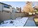 Townhouse exterior with fenced yard and walkway at 7900 W Layton Ave # 833, Littleton, CO 80123