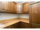 View of the kitchen's corner cabinets and wood countertops at 7900 W Layton Ave # 833, Littleton, CO 80123