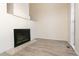 Bright living room features a fireplace and wood-look flooring at 7900 W Layton Ave # 833, Littleton, CO 80123