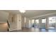 Spacious living room with large windows, sliding doors, and hardwood floors at 7900 W Layton Ave # 833, Littleton, CO 80123