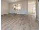 Open living room with wood-look floors and lots of natural light at 7900 W Layton Ave # 833, Littleton, CO 80123