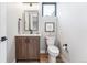 Modern bathroom with wood vanity and contemporary fixtures at 285 Bannock St, Denver, CO 80223