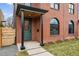 Inviting front entrance with a green door and brick facade at 285 Bannock St, Denver, CO 80223