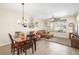 Dining area with wood table and chairs, adjacent to living room at 1851 S Buchanan Cir, Aurora, CO 80018