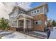 Two-story townhouse with stone and siding exterior, landscaping, and a walkway at 1851 S Buchanan Cir, Aurora, CO 80018