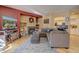 Living room with sectional sofa, fireplace, and built-in shelving at 9448 E Florida Ave # 1078, Denver, CO 80247