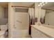 Clean bathroom with shower/tub combo and updated vanity at 9448 E Florida Ave # 1078, Denver, CO 80247