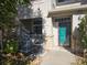Townhouse entry with teal door and two AC units at 9448 E Florida Ave # 1078, Denver, CO 80247