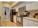 Kitchen with stainless steel appliances and light wood flooring at 9448 E Florida Ave # 1078, Denver, CO 80247