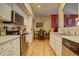Eat-in kitchen with stainless steel appliances and a dining area at 9448 E Florida Ave # 1078, Denver, CO 80247