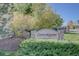 Community entrance sign with landscaping and street view at 9448 E Florida Ave # 1078, Denver, CO 80247