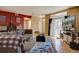 Living room with sectional sofa, hardwood floors, and access to patio at 9448 E Florida Ave # 1078, Denver, CO 80247