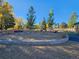 Sand play area with seating and small wooden play features at 9448 E Florida Ave # 1078, Denver, CO 80247