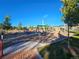 Community playground with multiple play areas and swings at 9448 E Florida Ave # 1078, Denver, CO 80247
