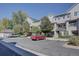 Parking lot with assigned parking spots and nearby building at 9448 E Florida Ave # 1078, Denver, CO 80247