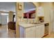Kitchen features white cabinets, stainless steel appliances, and a double sink at 9448 E Florida Ave # 1078, Denver, CO 80247