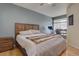 Main bedroom with a king-size bed and wood-framed headboard at 9448 E Florida Ave # 1078, Denver, CO 80247