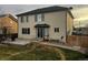 House exterior showing backyard patio and lawn at 12946 Kearney St, Thornton, CO 80602