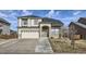 Two-story house with a neutral color scheme and stone accents at 12946 Kearney St, Thornton, CO 80602